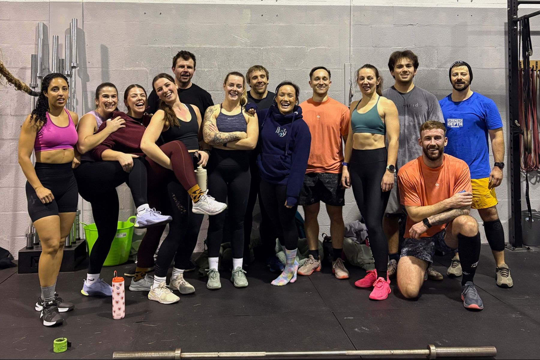 A big, smiling group of ORE members together after a CrossFit class